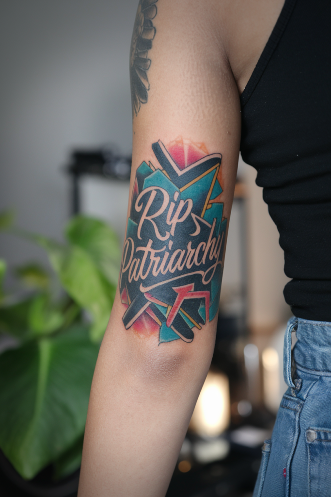 Vibrant RIP Patriarchy Tattoo with Geometric Pop